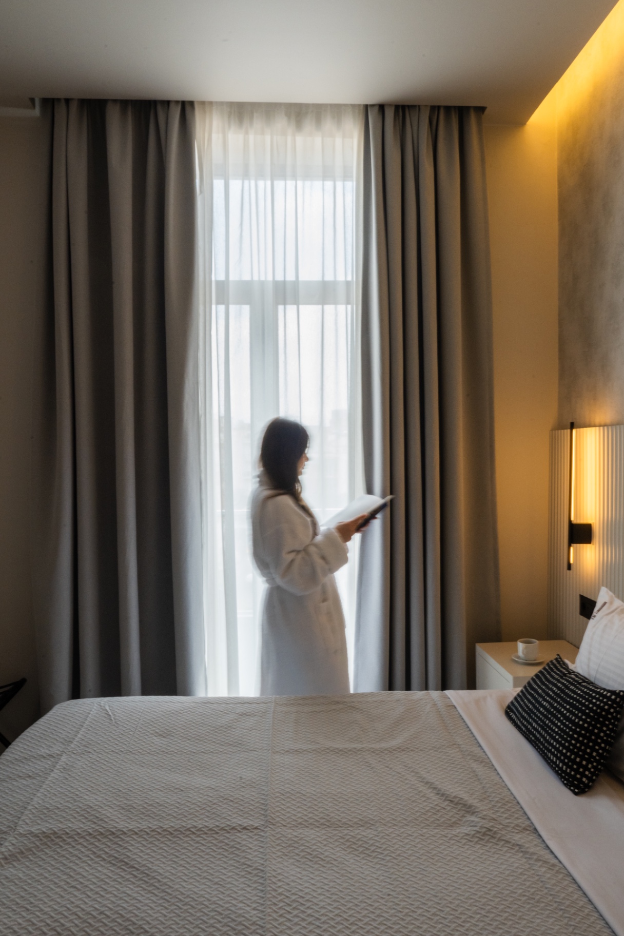 Interior of a Palladion suite with linen curtain and soft light